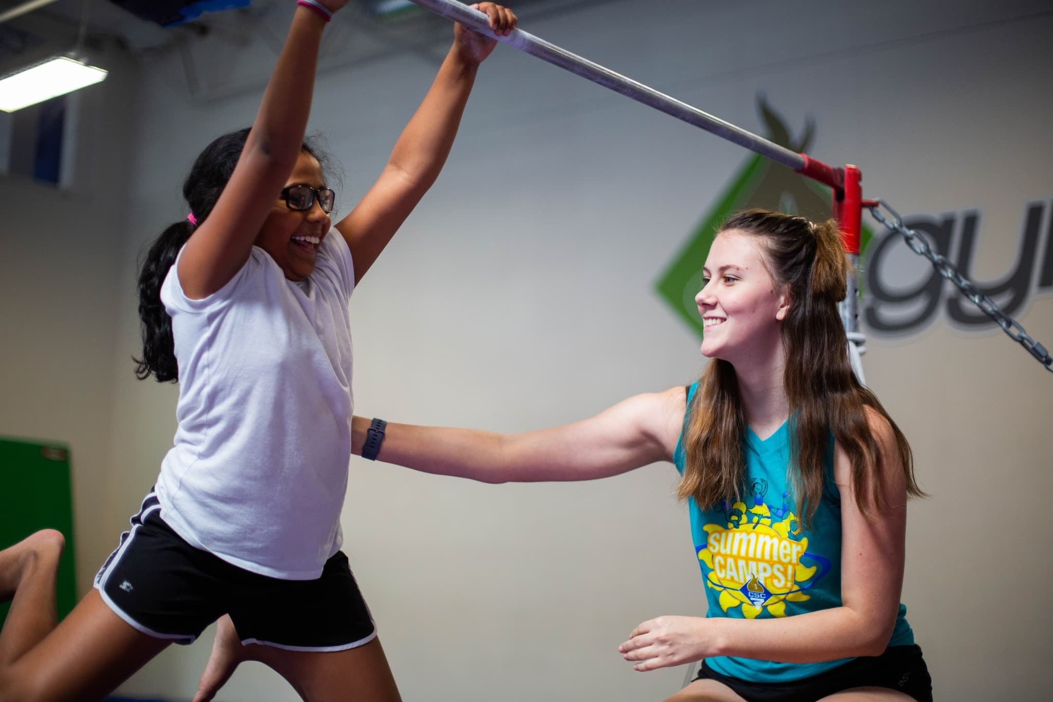 Coach and girl on a bar