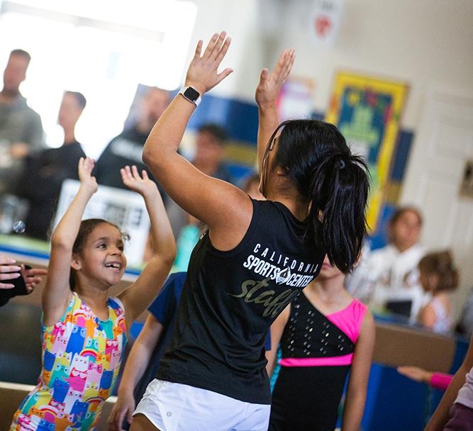 girl giving coach high five